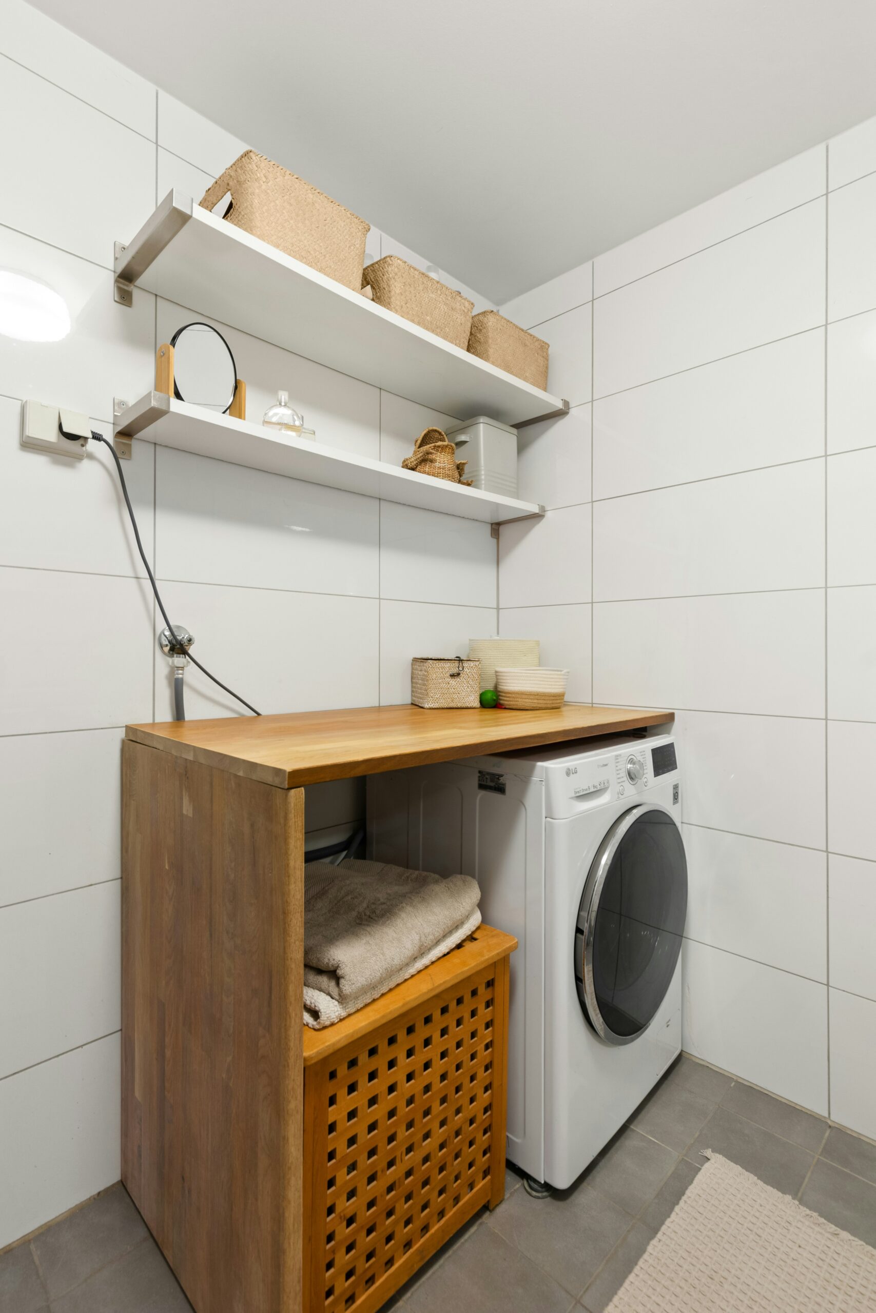 Flooring replacement and compact layout make this laundry room remodel