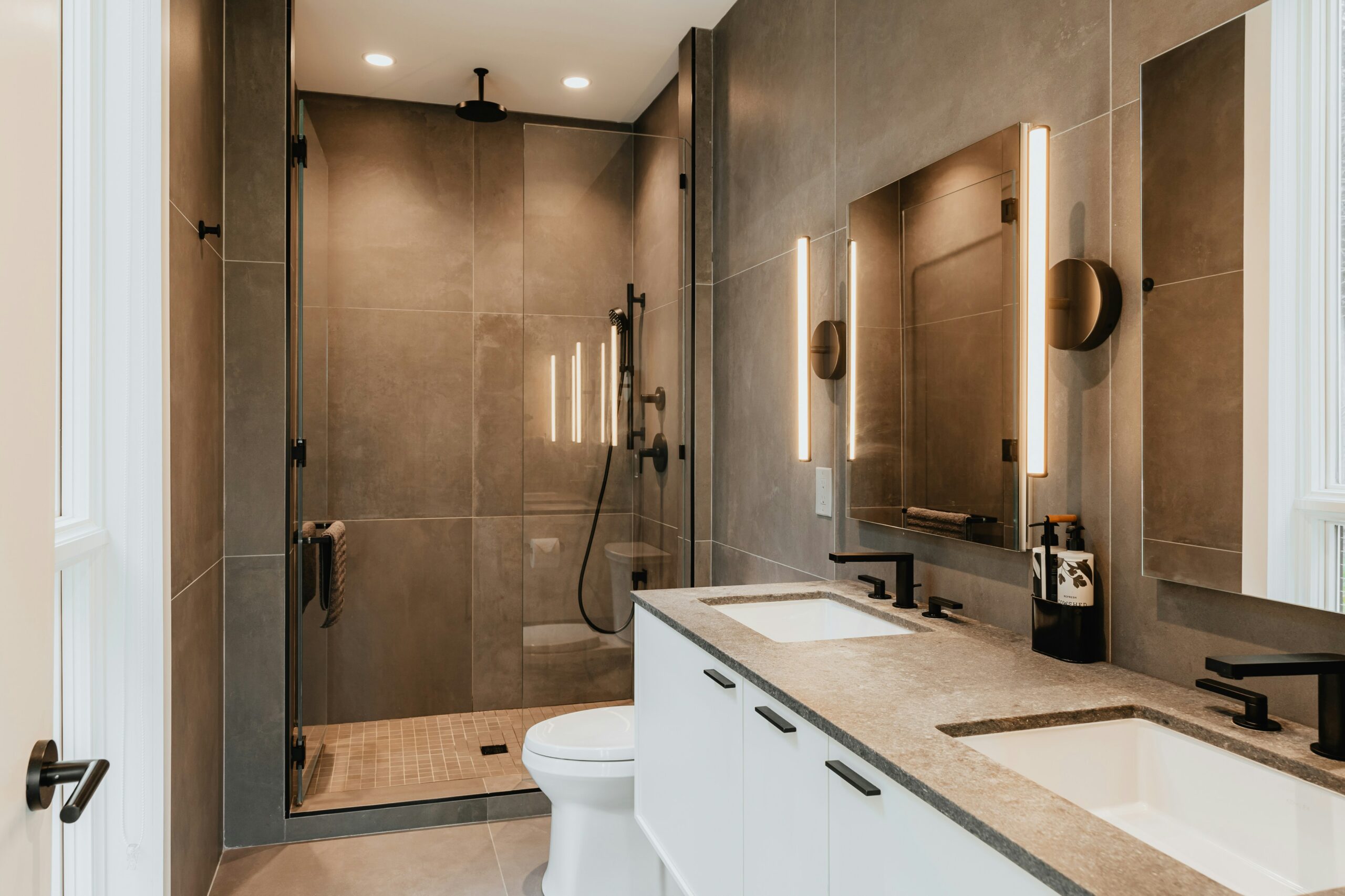 Premium countertops and ambient lighting define this luxury remodel.