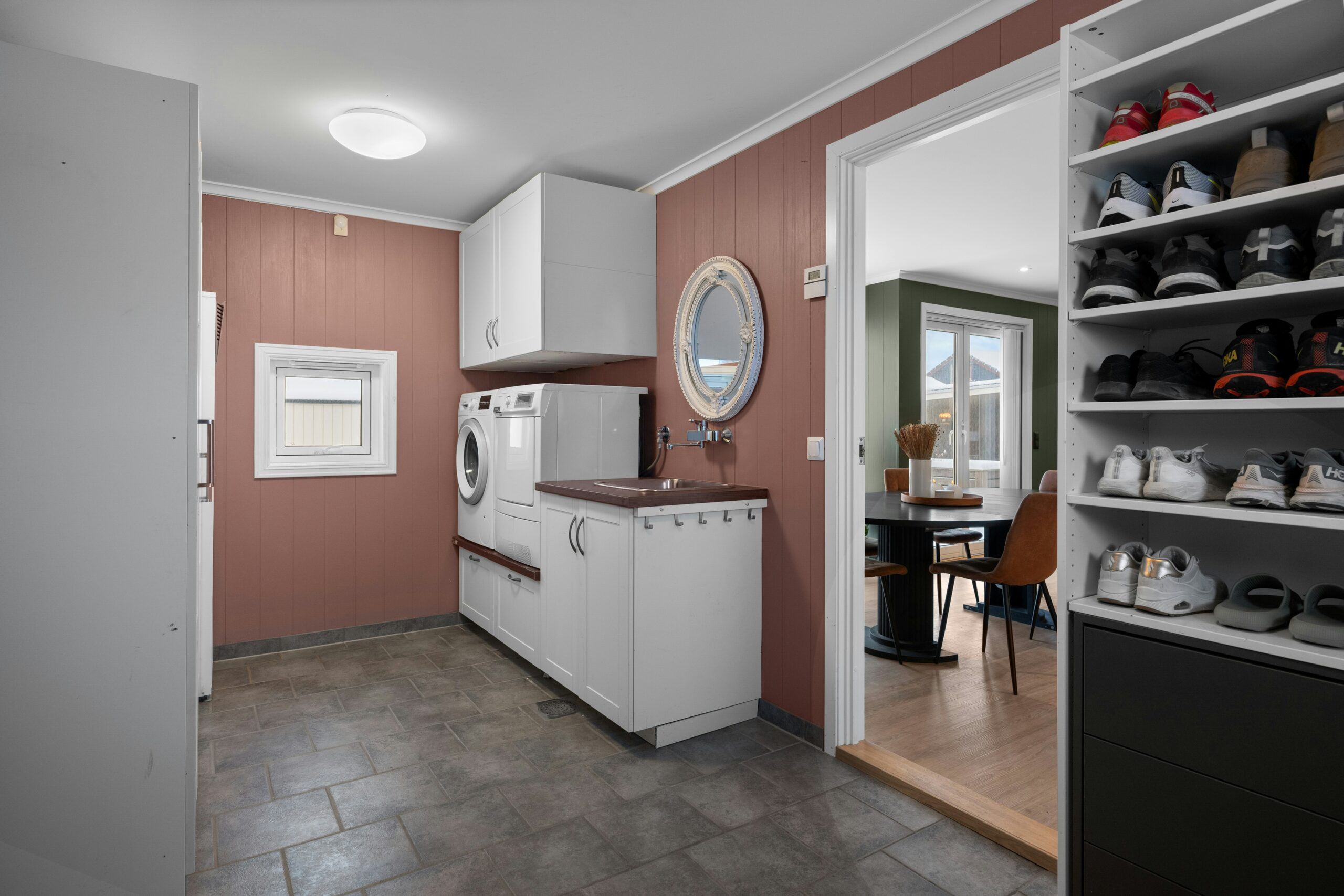 Wall paint and ceiling paint refresh this utility space, customized by home remodeling contractors near me.
