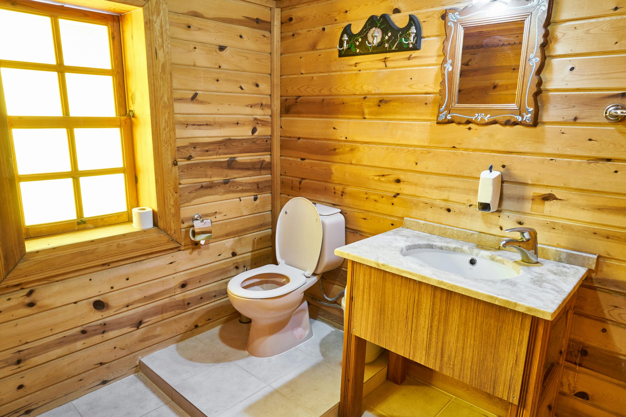 Warm lighting and handcrafted cabinets complete this rustic oasis.
